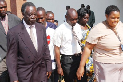 Presidential challenger Michael Sata, left.