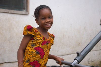 Girl at a water pump, Monrovia.