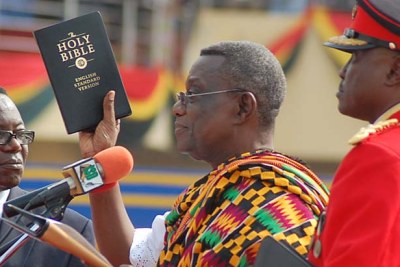 President John Atta Mills is sworn in during a ceremony in Independence Square, Accra.