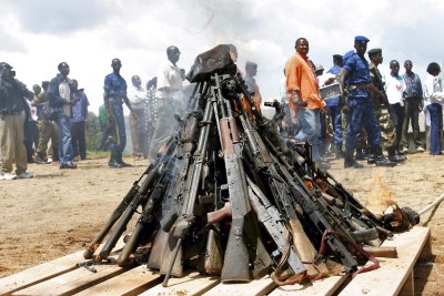 Weapons being burnt during the official launch of the Disarmament, Demobilization, Rehabilitation and Reintegration (DDRR) process in Muramvya, Burundi. Burundian military signed up voluntarily to be disarmed under the auspices of United Nations peacekeepers and observers.