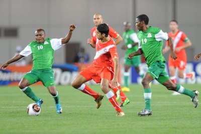 Chris Katongo and Thomas Nyirenda of Zambia challenge Oussama Darragi of Tunisia during the Africa Cup of Nations match (file photo).