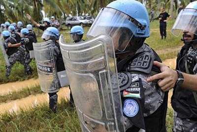 Peacekeepers from the United Nations Operation in Côte d'Ivoire (UNOCI) conduct crowd control exercises near Grand Bassam.