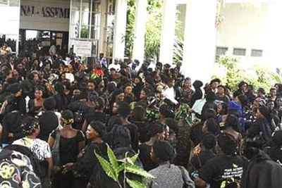 Women wearing black robes protest the killing of innocent women and children in Jos at the National Assembly, Abuja.