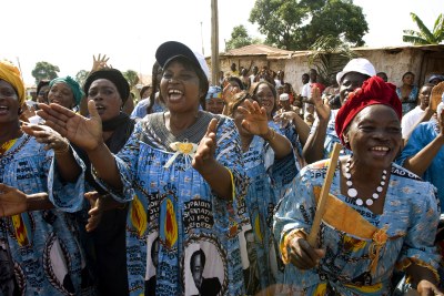 Women in Mbalmayo, Cameroon, clad in dresses with the image of Cameroonian President Paul Biya,