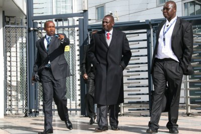 Eldoret North MP William Ruto, center, walks out of the ICC at The Hague after his initial appearance. (file photo)