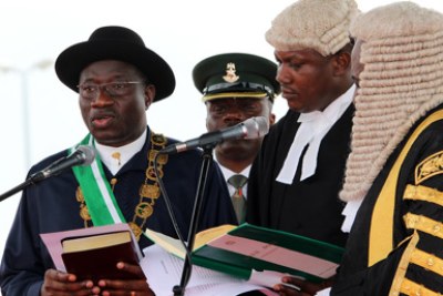 President Jonathan taking his oath of office.