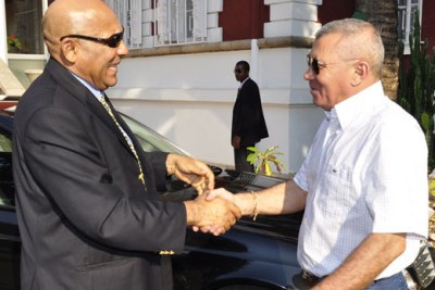 Malagasy's new Prime Minister Jean Omer Beriziky, left, is welcomed by his predecessor at his new office in Antananarivo.