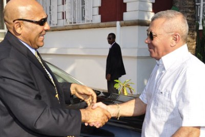 Malagasy's new Prime Minister Jean Omer Beriziky, left, welcomed by his predecessor Albert Camille Vital.