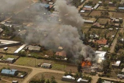 A residence is seen burning during post-election violence in the Rift Valley provincial capital Nakuru in 2008.
