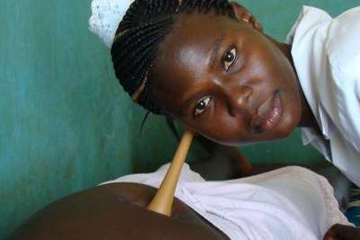 A midwife attends to an expectant mother (file photo).