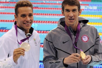 Chad le Clos, left, and Michael Phelps show their medals.