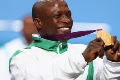 Yakubu Adesokan showing off his gold medal