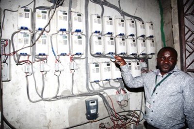 Tanzania Electric Supply Company Limited employee shows electric meters. The company has been plagued with alleged cases of corruption.