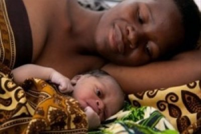 A mother and her newborn child. Family planning has been said to be a key determinant of development.