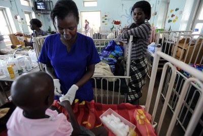 A young cancer patient receives care from a nurse at the Uganda Cancer Institute in Kampala (file photo).