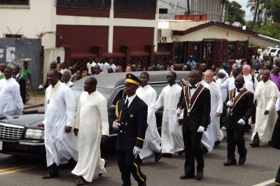 Body of Arch-Bishop Michael Francis being carried by Priests and church members