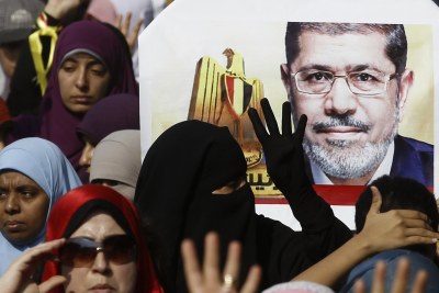 Supporters of the Muslim Brotherhood and ousted Egyptian President Mohamed Mursi take part in a protest (file photo).