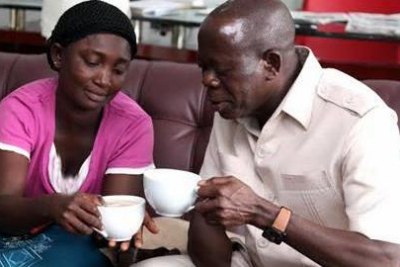 Oshiomhole shares a cup of tea with Mrs Joy Ifije