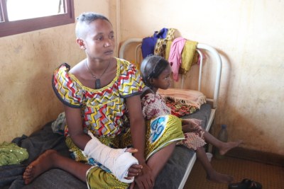 Peul woman and her daughter in Bangui's Hopital Communautaire. Both suffered machete attacks to the head when their village.