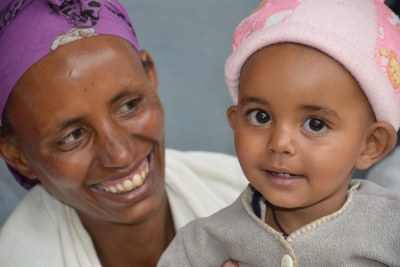 Mother and healthy baby in a family planning clinic in the Oromiyaa region of Ethiopia.
