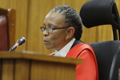 Judge Thokozile Masipa reads her verdict in the murder trial of paralympic athlete Oscar Pistorius in Pretoria.
