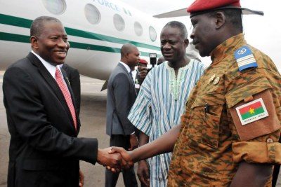 President Goodluck Jonathan of Nigeria greets interim Head of State of Burkina Faso, Lt. Col Isaac Zida in Ouagadougou.
