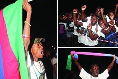 Michael Bosman, left, celebrates at Swapo offices in Windhoek; Nghishihange Paulus, bottom, was in joyous mood as he joined ruling party members, top, to celebrate their victory.