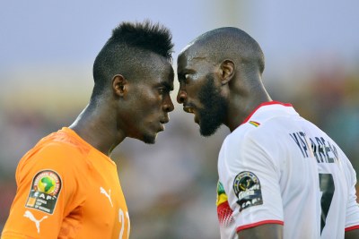 Eric Bailly of Cote d'Ivoire, left, and Mustapha Yatabare of Mali confront each other during their 2015 Africa Cup of Nations clash.