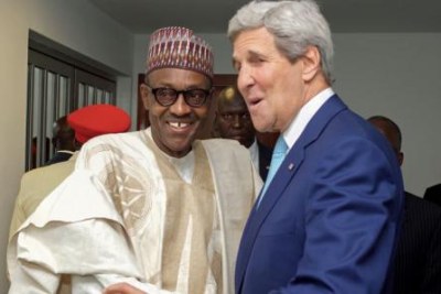 Secretary John Kerry shakes hands with newly sworn-in Nigerian President Muhammadu Buhari..