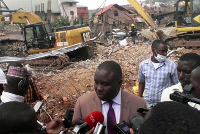 Kampala city lord mayor Eriasa Lukwago addresses the media shortly after inspecting the collapsed building.