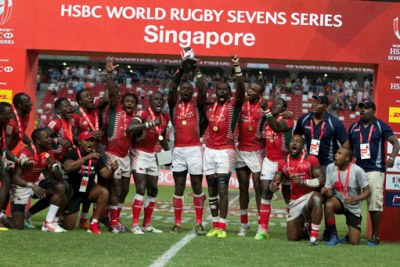 Kenya sevens rugby team players celebrate with the Main Cup trophy (file photo).