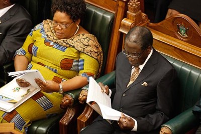 Former allies Joice Mujuru and Robert Mugabe.