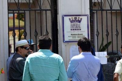 Imperial Bank customers outside Mombasa branch after learning of its closure (file photo)