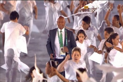 Veteran Kenyan athlete and two-time Olympic champion Kipchoge Keino, accompanied by children, runs towards the stage to receive the Olympic Laurel award at the opening ceremony of the Olympic Games at the Maracanā stadium in Rio de Janeiro, Brazil. GE has completed 80 lighting projects across Rio for the Olympic Games - including illumination of the Maracana stadium where the Opening Ceremony was held.