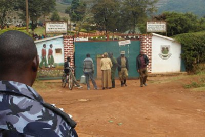 Policemen over seeing the situation at St Mary’s College Rushoroza main gate after a student was shot dead as police tried to calm the striking students.