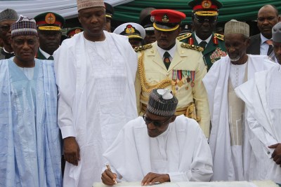 President Muhammadu Buhari Signing the Independence Anniversary Register in Abuja.