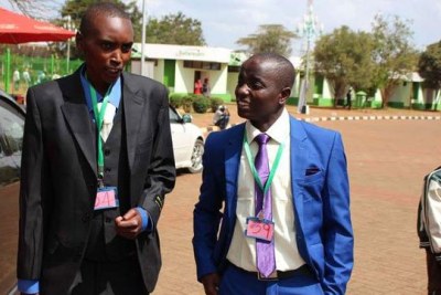 Ryan Muiruri 26, (left) with James Karanja, 26, a student of University of Nairobi during the press conference at Kasarani stadium.