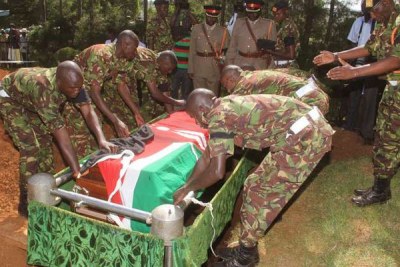 Kenya Defence Forces soldiers bury their colleague, who was killed by Al-Shabaab  in Somalia (file photo)