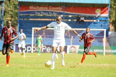 Harambee Stars midfielder Daniel Mwaura (centre) dribbles the ball during their international friendly match against Malawi at Kenyatta Stadium in Machakos on April 18, 2017.