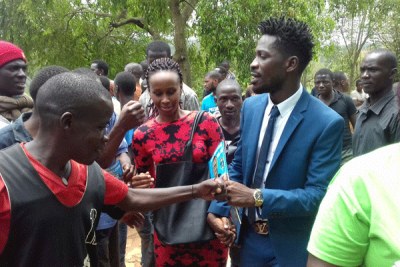 Bobi Wine greets locals in Gayaza, Kasangati recently.
