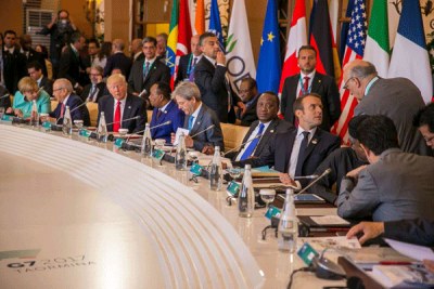 President Uhuru Kenyatta (sitting, fourth from right) and other world leaders at a Group of 7 session in Taormina in Sicily, Italy in May 2017.