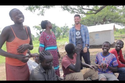Daniel interacting with children in Uganda.