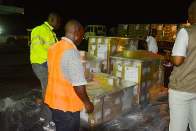 NEC staff take receipt of the boxes containing the presidential ballot papers.