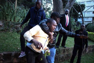 Nairobi Senator Johnson Sakaja shields Mathare MP Anthony Oluoch from being attacked at Panafric Hotel in Nairobi on October 26, 2017