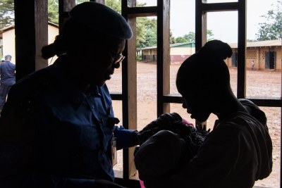 A young mother in the Central African Republic, right, was raped when she was 13. She subsequently named her baby after Gladys Ngwepekeum Nkeh, left, the UN police officer from Cameroon who cared for her after the assault.