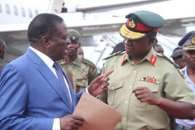 President Emmerson Mnangagwa chats with Zimbabwe Defence Forces Commander General Philip Valerio Sibanda.