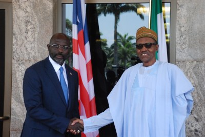 President Muhammadu Buhari, right, met behind closed doors with the visiting Liberian President George Weah.