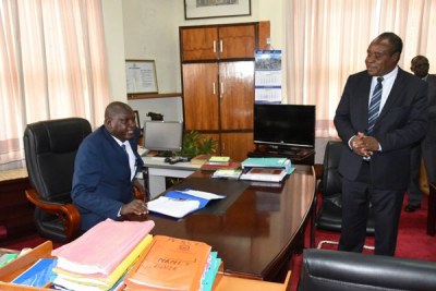 Moi University Vice Chancellor Prof Isaac Kosgey and outgoing acting VC Prof Laban Ayiro during the handing over at the main campus in Uasin Gishu County on March 21, 2018.