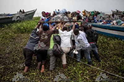 Over 50,000 people have fled by boat across Lake Albert to Uganda since mid-December.