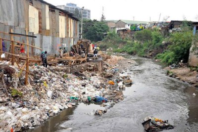 A section of the garbage-filled Nairobi River flows next to Machakos Country Bus Station.